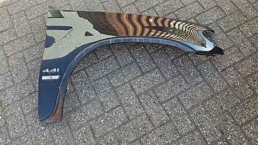 Voorscherm spatbord rechtsvoor BMW X5 serie E53 kleur Cosmos zwart 303 41357000386 7000386