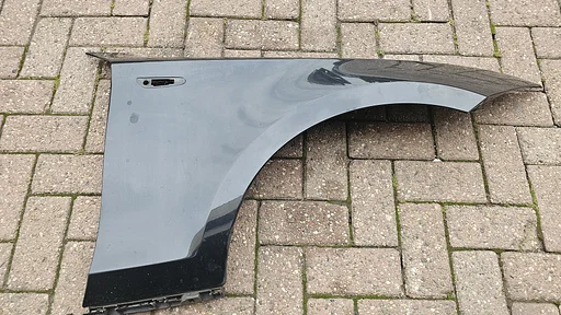 Voorscherm spatbord rechtsvoor BMW 1 erie E81 E82 E87 E88 kleur 475 41357133228 7133228