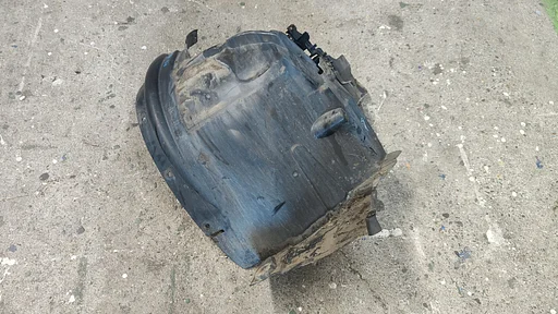 Binnenscherm Wielkuip Modderkuip voorzijde links BMW X6 serie E71 51717180621 7180621