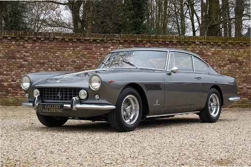Ferrari 250 GTE Series 1 by Pininfarina "Recently invested €200.000,-" Restored and rebuilt - Recently €200.000- spent on mechanics at Roelofs Engineering, Presented in the shade of Grigio Fumo over nero leather and rosso carpet, A matching numbers "first series" 250 GTE, One of the finest on the market, Only 299 models of the first generation were built, Powered by Ferrari's V12 Colombo engine,