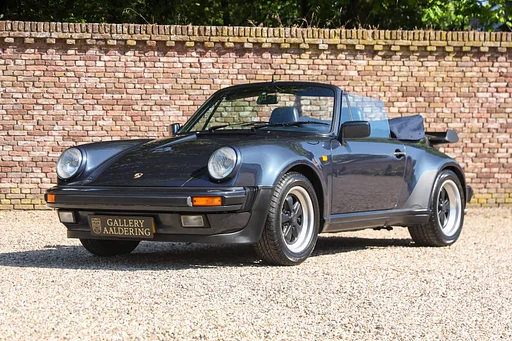 Porsche 930 Turbo Cabriolet "Newly delivered in Germany" The options sticker says “well-equipped with extras”, Finished in “Marine Blue Metallic” with ruffled leather upholstery in dark blue, The European specification 930 Turbo, Almost entirely original paint - "about 95%", The sound of an air-cooled boxer motor combined with the distinctive turbo whistle and the convertible top down - just like they used to do in t