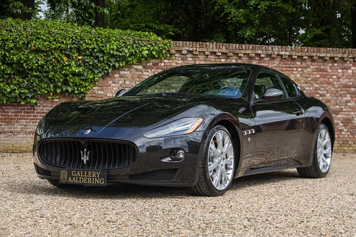 Maserati Granturismo S "with the Ferrari-red valve covers" Low mileage - maintained and serviced by the Maserati dealer,In first coat of paint: "Nero Carbonio",Documented with the booklets and invoices,"Yellow brake calipers and yellow stitching", Neptune design - AluTex - Saetto logo - Sport button (for a touch of extra) - None of this is necessary but it does have to be there, GranTurismo S - styled to be unique symbol of prestige,