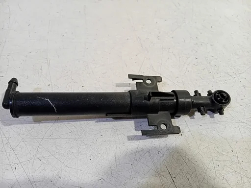 Koplampsproeier links Land Rover Discovery